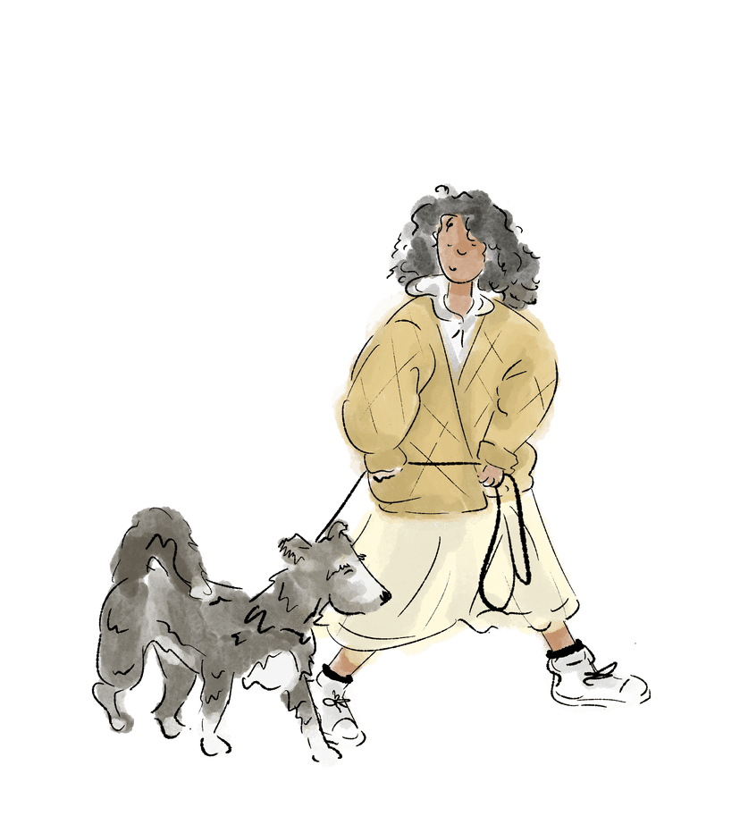 A stylish person walking a shaggy, chic dog